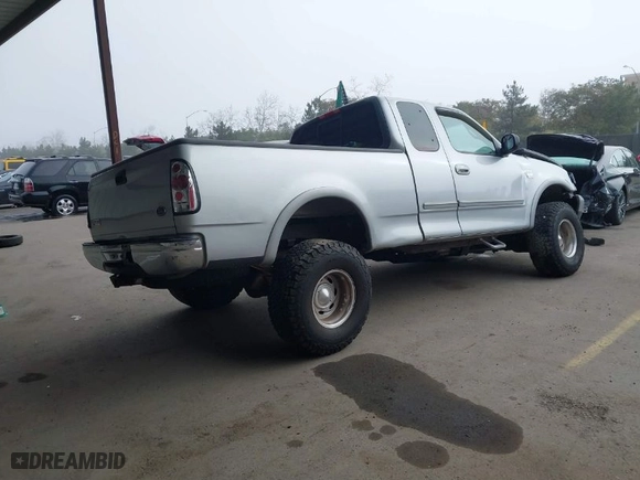 2000 Ford F-150 XL with VIN 1FTRX18L9YKA05396, listed as a IAAI auction lot 41637310 with 234,555 mi miles. Bid and sale history available at carsss.com. Image 4.