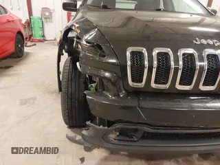2016 Jeep Cherokee Sport with VIN 1C4PJMAB0GW321370, listed as a IAAI auction lot 41487094 with 131,336 mi miles and . Bid and sale history available at DreamBid. Image 6.