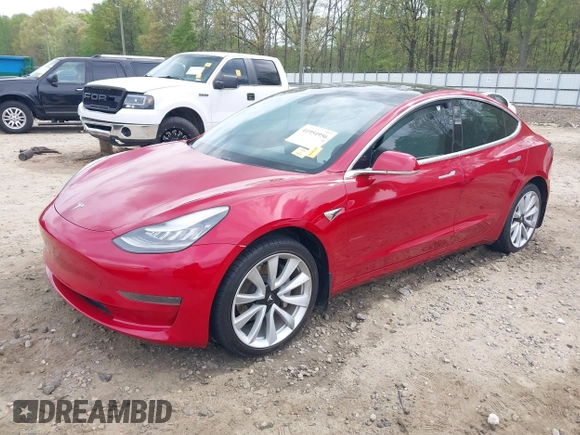 2019 Tesla Model 3 Mid Range z VIN 5YJ3E1EA7KF445040, wystawiony jako IAAI lot #41954956 z przebiegiem 68 004 mil mil oraz . Historia ofert i sprzedaży dostępna na DreamBid. Obrazek 2.