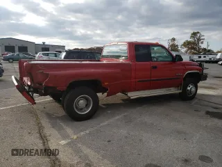 2002 Dodge Ram 3500 with VIN 3B7MF33652M205850, listed as a Copart auction lot 76749504 with 220,734 mi miles and Salvage Title. Bid and sale history available at carsss.com. Image 3.