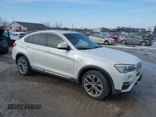 2015 BMW X4 xDrive28i with VIN 5UXXW3C52F0M89272, listed as a IAAI auction lot 41564237 with 75,823 mi miles. Bid and sale history available at carsss.com. Image 1.