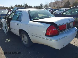 2002 Mercury Grand Marquis LS Premium z VIN 2MEFM75W92X641347, wystawiony jako IAAI lot #41701179 z przebiegiem 79 942 mil mil oraz . Historia ofert i sprzedaży dostępna na DreamBid. Obrazek 3.