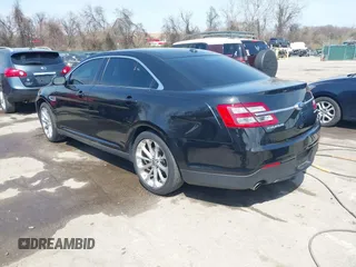 2014 Ford Taurus Limited with VIN 1FAHP2F80EG104984, listed as a IAAI auction lot 41910463 with 174,034 mi miles. Bid and sale history available at carsss.com. Image 3.