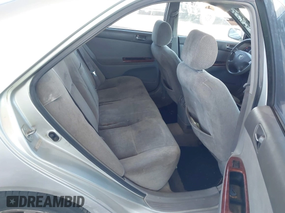 2003 Toyota Camry LE with VIN JTDBE32K730176610, listed as a IAAI auction lot 41627010 with 238,502 mi miles and . Bid and sale history available at DreamBid. Image 8.