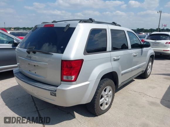 2010 Jeep Grand Cherokee Laredo with VIN 1J4PR4GK1AC143780, listed as a IAAI auction lot 42058575 with 88,608 mi miles. Bid and sale history available at carsss.com. Image 4.