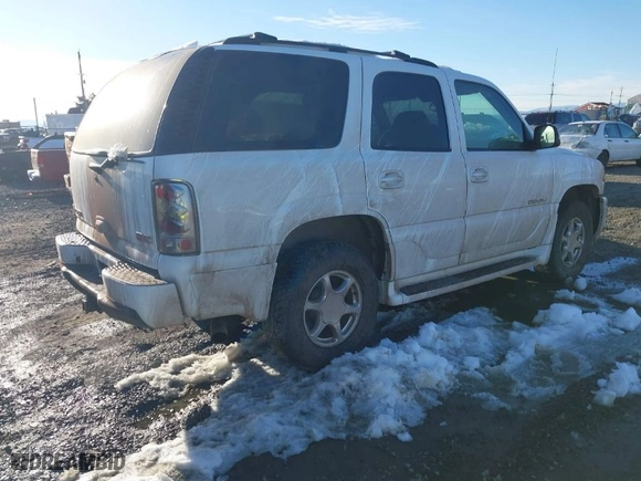 2005 GMC Yukon Denali with VIN 1GKEK63U45J175021, listed as a IAAI auction lot 41565852 with 112,203 mi miles. Bid and sale history available at carsss.com. Image 4.