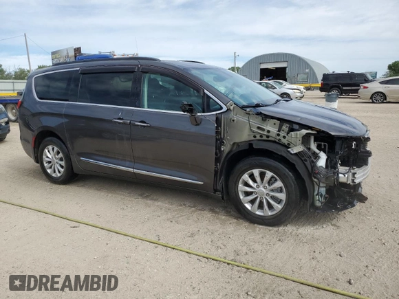 2017 Chrysler Pacifica Touring L with VIN 2C4RC1BG7HR569315, listed as a Copart auction lot 47018605 with 131,519 mi miles and Salvage Title. Bid and sale history available at DreamBid. Image 4.