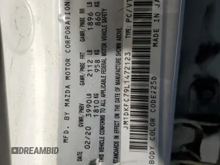 2020 Mazda CX-3 GS z VIN JM1DKFC79L1472123, wystawiony jako Copart lot #73379514 z przebiegiem 85 815 mil mil oraz Szkoda całkowita • Salvage title. Historia ofert i sprzedaży dostępna na DreamBid. Obrazek 14.