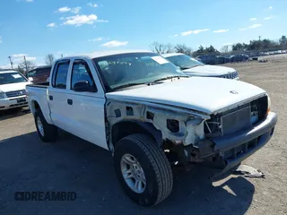 2004 Dodge Dakota Sport with VIN 1D7HG38N64S770557, listed as a IAAI auction lot 41694249 with 153,656 mi miles. Bid and sale history available at carsss.com. Image 1.