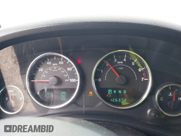 2012 Jeep Wrangler Sport z VIN 1C4AJWAG5CL171961, wystawiony jako IAAI lot #42590232 z przebiegiem 126 372 mil mil oraz . Historia ofert i sprzedaży dostępna na DreamBid. Obrazek 7.