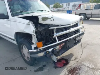 1997 Chevrolet Suburban with VIN 3GNFK16R9VG187426, listed as a IAAI auction lot 41678063 with 131,387 mi miles. Bid and sale history available at carsss.com. Image 6.