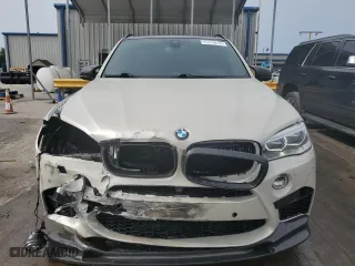 2016 BMW X5 M with VIN 5YMKT6C54G0R79100, listed as a Copart auction lot 55699044 with 106,772 mi miles. Bid and sale history available at carsss.com. Image 5.
