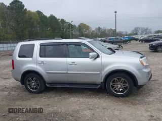2014 Honda Pilot Touring with VIN 5FNYF4H91EB011934, listed as a IAAI auction lot 41929415 with 227,343 mi miles and . Bid and sale history available at DreamBid. Image 13.