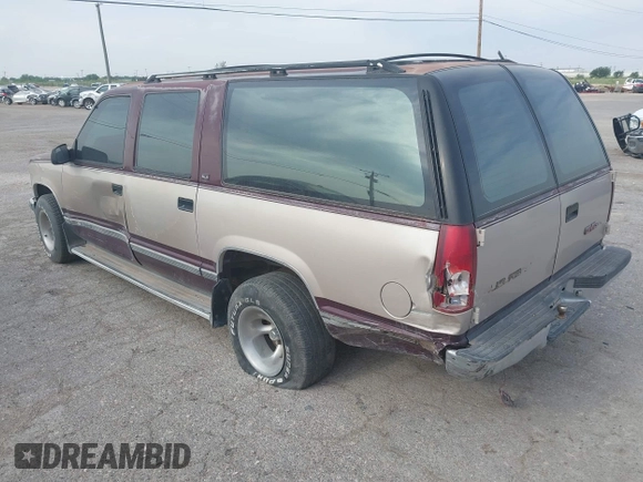 1993 GMC Suburban with VIN 1GKEC16KXPJ734150, listed as a IAAI auction lot 42114021 with 254,501 mi miles and . Bid and sale history available at DreamBid. Image 3.