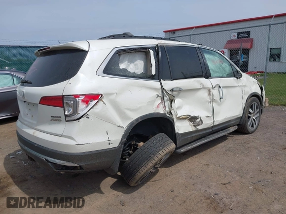 2016 Honda Pilot Touring with VIN 5FNYF6H90GB102403, listed as a IAAI auction lot 42007825 with 69,450 mi miles. Bid and sale history available at carsss.com. Image 4.