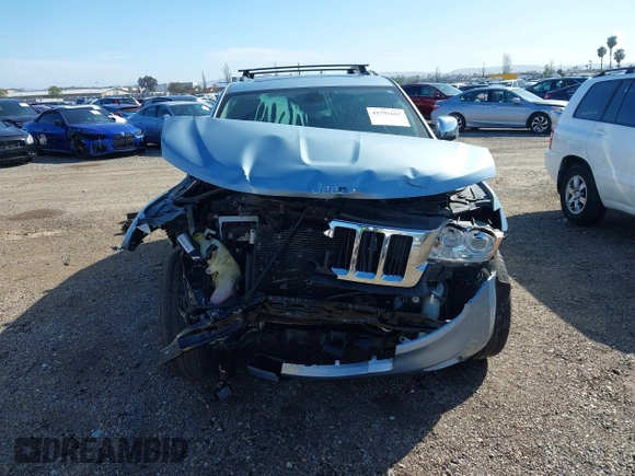 2012 Jeep Grand Cherokee Limited z VIN 1C4RJFBTXCC341813, wystawiony jako IAAI lot #41791662 z przebiegiem 120 811 mil mil oraz . Historia ofert i sprzedaży dostępna na DreamBid. Obrazek 13.
