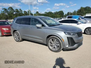 2023 Cadillac XT6 FWD Premium Luxury with VIN 1GYKPCRS0PZ231233, listed as a Copart auction lot 73210244 with 14,604 mi miles and Salvage Title. Bid and sale history available at carsss.com. Image 4.