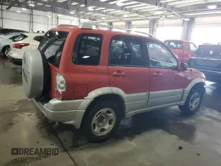 2004 Suzuki Grand Vitara LX z VIN JS3TD62V444101460, wystawiony jako Copart lot #70063234 z przebiegiem 113 618 mil mil oraz Szkoda całkowita • Salvage title. Historia ofert i sprzedaży dostępna na DreamBid. Obrazek 3.
