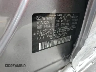 2022 Genesis G70 2.0T z VIN KMTG34TAXNU094262, wystawiony jako Copart lot #54213245 z przebiegiem 70 819 mil mil oraz Szkoda całkowita • Salvage title. Historia ofert i sprzedaży dostępna na DreamBid. Obrazek 12.