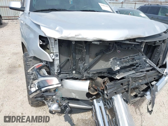 2015 Chevrolet Tahoe LT with VIN 1GNSCBKC4FR552034, listed as a IAAI auction lot 41891302 with 145,969 mi miles and . Bid and sale history available at DreamBid. Image 6.