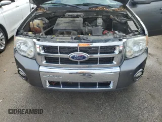 2012 Ford Escape Limited z VIN 1FMCU0EG1CKB30638, wystawiony jako Copart lot #52905205 z przebiegiem 169 683 mil mil oraz Szkoda całkowita • Salvage title. Historia ofert i sprzedaży dostępna na DreamBid. Obrazek 14.