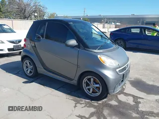 2014 Smart fortwo Pure with VIN WMEEJ3BA1EK779450, listed as a IAAI auction lot 41882982 with 121,802 mi miles and . Bid and sale history available at DreamBid. Image 1.