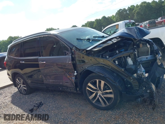 2017 Honda Pilot Touring with VIN 5FNYF5H91HB038268, listed as a IAAI auction lot 42786448 with 62,195 mi miles and . Bid and sale history available at DreamBid. Image 14.