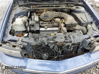 1995 Cadillac DeVille z VIN 1G6KD52B3SU243924, wystawiony jako Copart lot #56945395 z przebiegiem 72 878 mil mil oraz Szkoda całkowita • Salvage title. Historia ofert i sprzedaży dostępna na DreamBid. Obrazek 11.