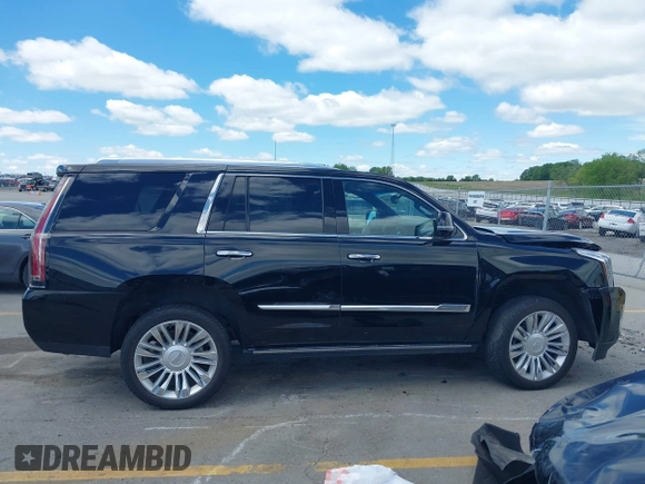 2015 Cadillac Escalade Platinum z VIN 1GYS4PKJ8FR568958, wystawiony jako IAAI lot #42316098 z przebiegiem 152 661 mil mil oraz . Historia ofert i sprzedaży dostępna na DreamBid. Obrazek 13.