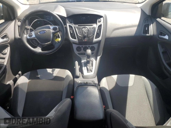 2014 Ford Focus SE z VIN 1FADP3K24EL317353, wystawiony jako Copart lot #57181215 z przebiegiem 144 495 mil mil oraz Szkoda całkowita • Salvage title. Historia ofert i sprzedaży dostępna na DreamBid. Obrazek 8.