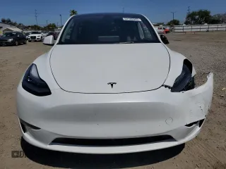 2023 Tesla Model Y Long Range z VIN 7SAYGDEE2PA061792, wystawiony jako Copart lot #52106965 z przebiegiem 11 968 mil mil oraz Szkoda całkowita • Salvage title. Historia ofert i sprzedaży dostępna na DreamBid. Obrazek 5.