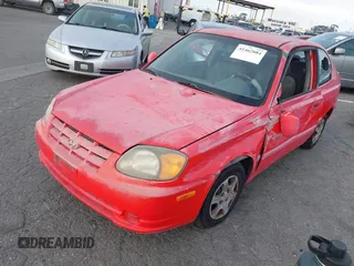 2003 Hyundai Accent GL with VIN KMHCG35C23U238969, listed as a IAAI auction lot 41462884 with 156,682 mi miles. Bid and sale history available at carsss.com. Image 2.