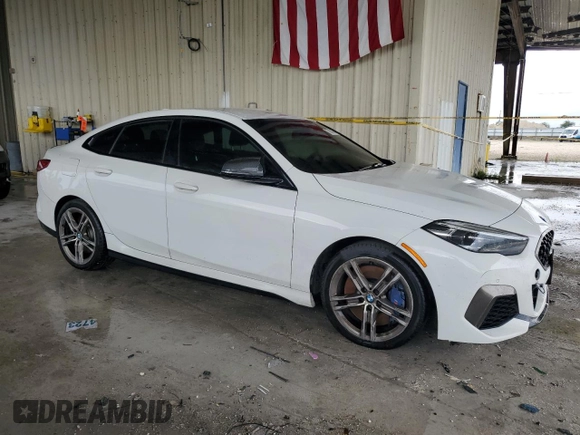 2020 BMW 2 Series M235i xDrive with VIN WBA13AL07L7F63068, listed as a Copart auction lot 73824364 with 62,138 mi miles and Salvage Title. Bid and sale history available at carsss.com. Image 4.