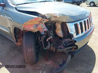 2011 Jeep Grand Cherokee Laredo with VIN 1J4RR4GGXBC587911, listed as a IAAI auction lot 42156885 with 178,999 mi miles and . Bid and sale history available at DreamBid. Image 6.