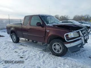 2000 Ford F-150 XL with VIN 1FTRX18L2YNA50128, listed as a IAAI auction lot 40956879 with 1 mi miles. Bid and sale history available at carsss.com. Image 1.