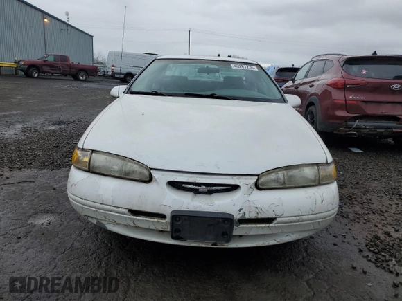 1997 Ford Thunderbird LX z VIN 1FALP62W2VH154138, wystawiony jako Copart lot #46281235 z przebiegiem 145 738 mil mil oraz Tytuł czysty. Historia ofert i sprzedaży dostępna na DreamBid. Obrazek 5.