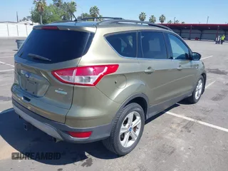 2013 Ford Escape SE with VIN 1FMCU0G99DUC05901, listed as a IAAI auction lot 42194672 with 121,435 mi miles and . Bid and sale history available at DreamBid. Image 4.