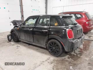2017 MINI Hardtop 4 Door Cooper z VIN WMWXU1C34H2F78228, wystawiony jako IAAI lot #41549060 z przebiegiem 49 393 mil mil oraz . Historia ofert i sprzedaży dostępna na DreamBid. Obrazek 15.