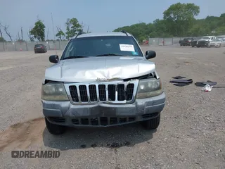2002 Jeep Grand Cherokee Laredo with VIN 1J4GW48SX2C313093, listed as a IAAI auction lot 42446559 with 200,319 mi miles and . Bid and sale history available at DreamBid. Image 12.