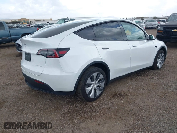 2023 Tesla Model Y Long Range with VIN 7SAYGDEE6PA064162, listed as a IAAI auction lot 41533464 with 24,337 mi miles. Bid and sale history available at carsss.com. Image 4.