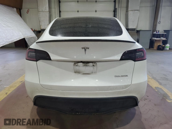 2022 Tesla Model Y Performance with VIN 7SAYGDEF7NF520825, listed as a Copart auction lot 57400245 with 55,437 mi miles and Salvage title. Bid and sale history available at DreamBid. Image 6.