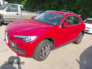 2019 Alfa Romeo Stelvio Ti z VIN ZASPAKBNXK7C31179, wystawiony jako IAAI lot #42489493 z przebiegiem 53 843 mil mil oraz . Historia ofert i sprzedaży dostępna na DreamBid. Obrazek 2.