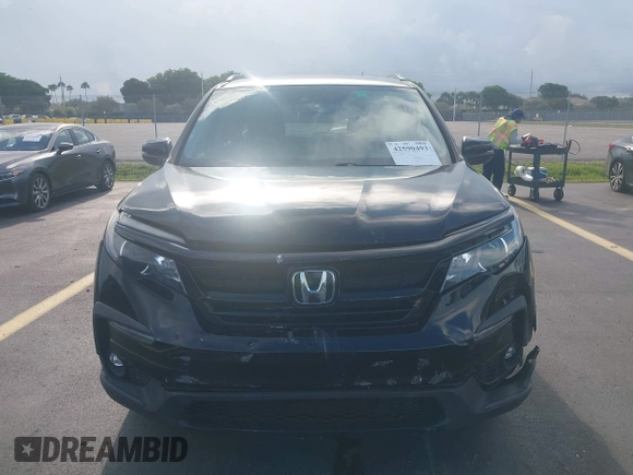 2022 Honda Pilot Special Edition with VIN 5FNYF5H25NB026414, listed as a IAAI auction lot 42590493 with 26,600 mi miles and . Bid and sale history available at DreamBid. Image 12.
