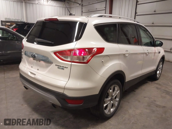 2016 Ford Escape Titanium with VIN 1FMCU9J99GUA61848, listed as a IAAI auction lot 42300324 with 51,692 mi miles and . Bid and sale history available at DreamBid. Image 4.