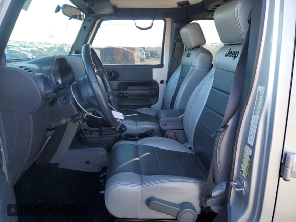 2007 Jeep Wrangler Unlimited Sahara with VIN 1J4GB59197L144781, listed as a Copart auction lot 48678315 with 137,538 mi miles and Salvage title. Bid and sale history available at DreamBid. Image 7.