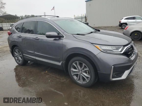 2021 Honda CR-V Touring with VIN 2HKRW1H96MH420465, listed as a Copart auction lot 86885384 with 61,699 mi miles and Salvage Title. Bid and sale history available at carsss.com. Image 4.