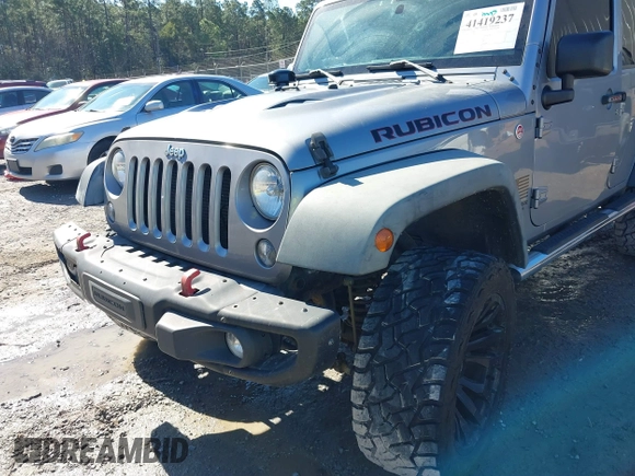 2015 Jeep Wrangler Unlimited Rubicon Hard Rock with VIN 1C4HJWFG2FL587607, listed as a IAAI auction lot 41419237 with 109,719 mi miles and . Bid and sale history available at DreamBid. Image 6.