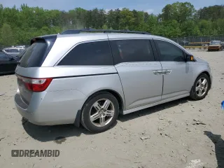 2012 Honda Odyssey Touring with VIN 5FNRL5H93CB121366, listed as a Copart auction lot 55383885 with 197,885 mi miles and Salvage title. Bid and sale history available at DreamBid. Image 3.