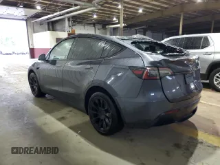 2023 Tesla Model Y Long Range z VIN 7SAYGDEE8PF814874, wystawiony jako Copart lot #56546365 z przebiegiem 20 919 mil mil oraz Szkoda całkowita • Salvage title. Historia ofert i sprzedaży dostępna na DreamBid. Obrazek 2.