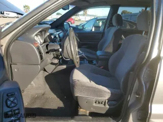 1999 Jeep Grand Cherokee Laredo with VIN 1J4GW58NXXC747537, listed as a Copart auction lot 87310234 with 0 mi miles and Salvage Title. Bid and sale history available at carsss.com. Image 7.